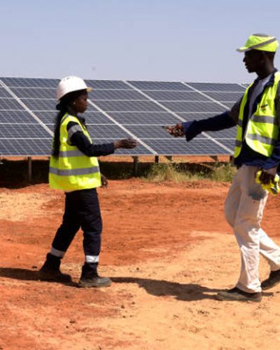 Technicians walk through solar panels on October 22, 2016 during the opening ceremony of a new photovoltaic energy production site in Bokhol.
Senegal put into service one of sub-Saharan Africa's largest solar energy projects Saturday as it pushes to become a regional player in renewables on a continent where the majority remain off-grid. / AFP PHOTO / SEYLLOU        (Photo credit should read SEYLLOU/AFP via Getty Images)